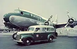 A photograph of an aircraft with four propellers in the air