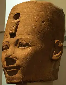 A osiride stone head from Karnak, most likely depicting Thutmose I, on display at the British Museum