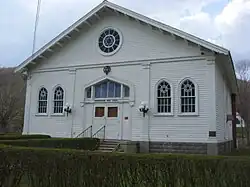 The same white building from the photograph above, viewed looking directly at the front