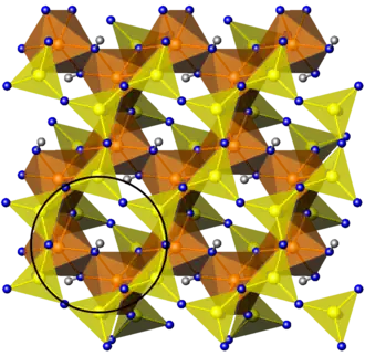 Aluminosilicate layer T-O'-T. The black circle indicates six-membered rings.
