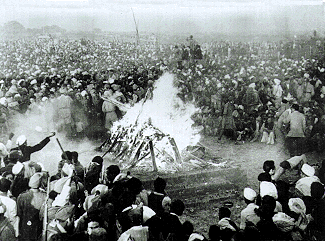 Cremation of Mahatma Gandhi at Rajghat, 31 January 1948. It was attended by Jawaharlal Nehru, Lord and Lady Mountbatten, Maulana Azad, Rajkumari Amrit Kaur, Sarojini Naidu and other national leaders. His son Devdas Gandhi lit the pyre.[112]