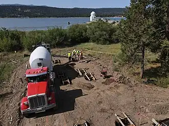 Crews pour concrete footings, the first step in the construction of a permanent home of the NSF’s SOLIS instrument at Big Bear Solar Observatory in California