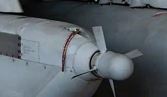 Cropped view of the ram air turbine –the turbine has four blades which spin continuously to power the jamming system when the aircraft is in flight.