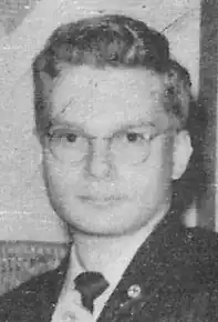 Black and white photo of Burros in a suit