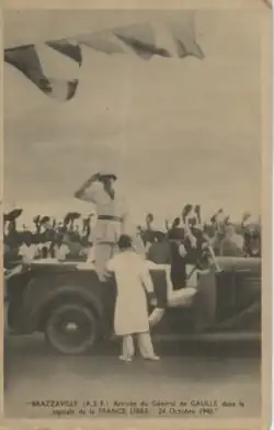 Photo of Charles de Gaulle greeting before getting out of car.