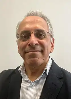 Head and shoulder profile photograph of Deepak Uttamchandani