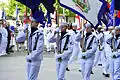 Members of the Navy Ceremonial Guard parade the fifty state flags before a wreath-laying ceremony at the Navy Memorial in Washington D.C.
