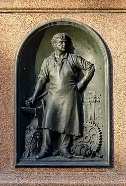 One of the four bronze reliefs depicting local industry.