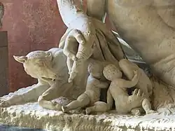 Romulus and Remus under an arm of the Tiber.