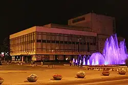 The theatre and fountain at night