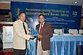 Baharul Islam being handed over a Dept of IT memento at a Govt of India function at Guwahati (India) Feb 2010