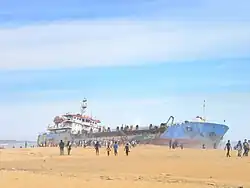 A dredger ship washed up on the Mundakkal beach