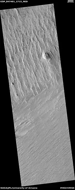 Wide view of yardangs, as seen by HiRISE under HiWish program This image is odd in that the yardangs are lined up in different directions in the top and bottom part of image. The wind direction probably changed to cause this. Location is Memnonia quadrangle.