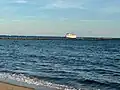 View of the breakwater from the east end of the beach. The boat is the Block Island Ferry.