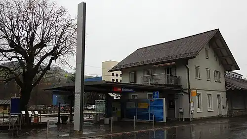 Three-story building with gabled roof