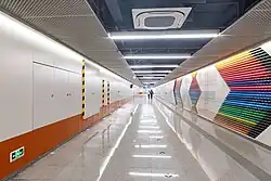 Exit B underpass passage with mural of 'Coloured Life'