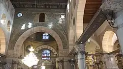 Decorated wall above mihrab near central dome facing main entrance[105]