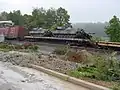US Army tanks on a derailed flatbed car