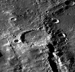 An image of Vallis Planck getting disrupted by the Fechner Crater as it travels northwest