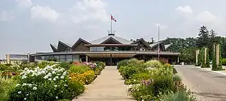 A round building viewed past numerous blooms