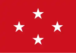 a red flag with four white stars
