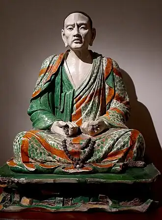 Statue of the luohan Tamrabhadra, one of the group of glazed pottery luohans from Yixian; 10th–13th century; glazed terracotta; height: 123 cm; Guimet Museum (Paris)
