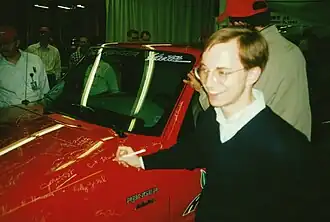 Ford Ranger EV "Job #1" - the first production unit - being signed by a member of Ford's EV Engineering Team during the launch event at the factory in Detroit, Michigan USA in 1998. This unit, Ford's first-ever production electric vehicle, had just been driven off the assembly line by Ford CEO Alex Trotman.