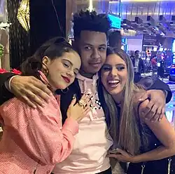 Fuego with Rosalia (left) and Lele Pons (right) during the 2018 Latin Grammys week in Las Vegas, Nevada.