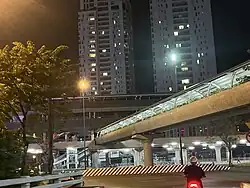 Thảo Điền station with Thảo Điền Pearl Apartment behind at night