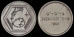 Gemini 6 mission emblem and crew names (front). Flight dates (back)