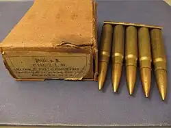 five cartridges held together at their bases by a strip of metal