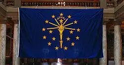 Giant Indiana state flag held at the Indiana Statehouse.