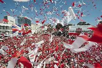 Image 35Thousands of Gibraltarians dress in their national colours of red and white and fill Grand Casemates Square during the 2013 Gibraltar National Day celebrations (from Culture of Gibraltar)