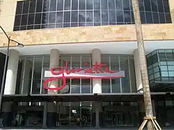 The facade of the rebuilt Glorietta 1 & 2 along Palm Drive