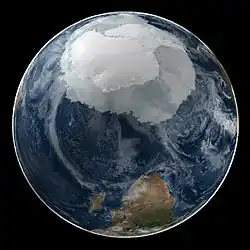 Image 77A composite image of Earth, with its different types of surface discernible: Earth's surface dominating Ocean (blue), Africa with lush (green) to dry (brown) land and Earth's polar ice in the form of Antarctic sea ice (grey) covering the Antarctic or Southern Ocean and the Antarctic ice sheet (white) covering Antarctica. (from Earth)