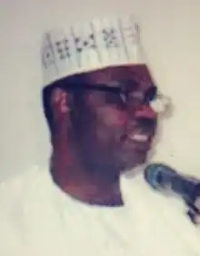 Godwin Abbe speaking on TV with microphone