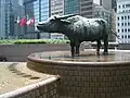A water buffalo by English sculptor Elisabeth Frink stands in Exchange Square