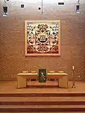 The large reredos panel crafted by Leonard French above the Communion Table in the Sanctuary.
