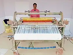 Weaver from India showing handloom during an exhibition