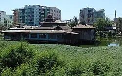 A Nat shrine in a pond, Hlaing Township