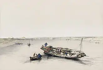 129. View looking towards the Pyramids of Dashour and Sacara - Slave boat on the Nile.