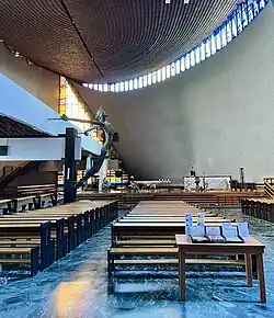 View of the main nave with Bronisław Chromy 's crucifix on the left.