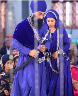 A Sikh man and woman both with turbans