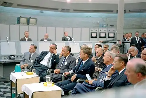NASA administrator James Webb, VP Johnson and President Kennedy are briefed during a tour of Blockhouse 34 in 1962