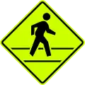 W10F Pedestrian crossing ahead. This fluorescent green version is unofficial.