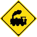Traffic sign in Japan warning that the road crosses a railway