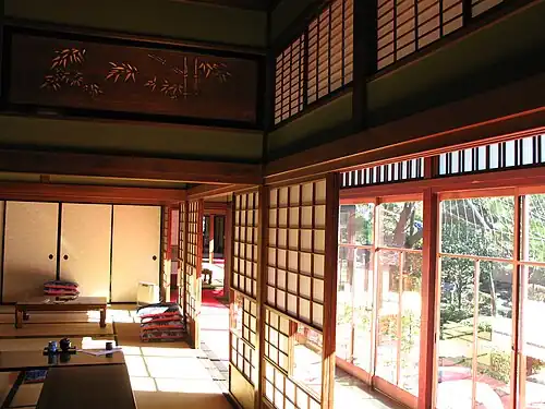 Paper-coated nekoma shoji (with sliding sub-panel for view) inside the engawa, and all-glass garasu-do outside