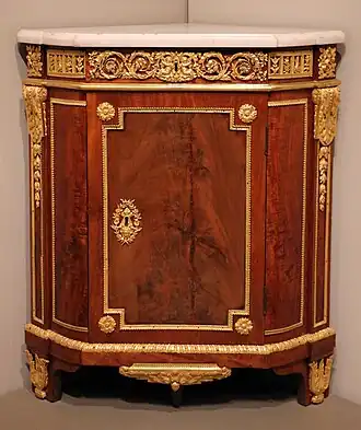 Parisian corner cabinet; by Jean Henri Riesener; 1780–1790; oak, mahogany, marble, and ormolu mounts; 94.3 × 81.3 × 55.9 cm; Art Institute of Chicago, US[69]