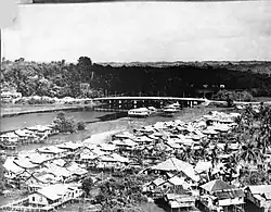 View of the stilt houses of Kampong Sumbiling Lama and the Edinburgh Bridge in 1964