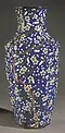 Vase using moriage shippō (盛上七宝) technique to raise the plum blossom and branches (c. 1905)[7]